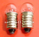 Miniature bulb 12v 5w E10 base clear glass bulb set on orange background